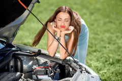 sad-woman-near-broken-car-waits-assistance-her-down-road-side-44115208